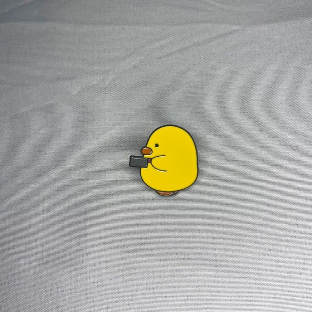 Yellow Cartoon Duck Enamel Pin - Cute Duck Design with Grey knife